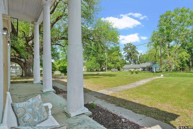 view of yard featuring covered porch