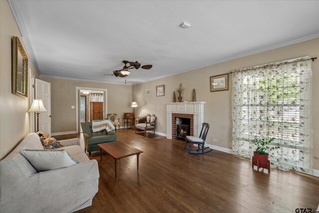 living area with crown molding, ceiling fan, and a healthy amount of sunlight