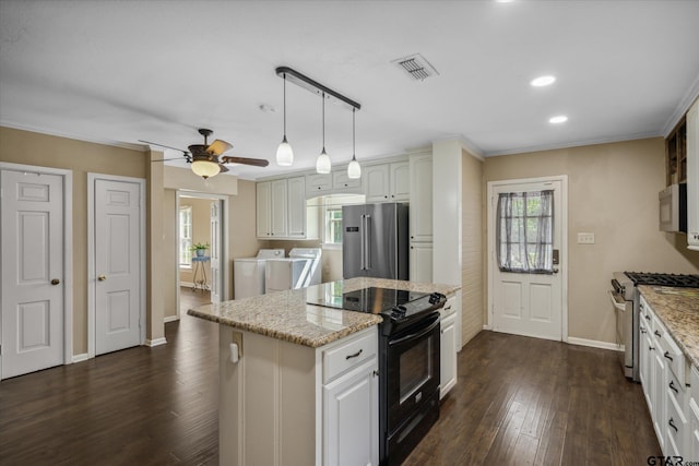 kitchen featuring washer and clothes dryer, visible vents, dark wood-type flooring, light stone countertops, and high quality appliances