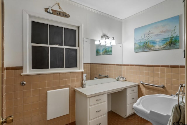 bathroom with wainscoting, ornamental molding, and tile walls