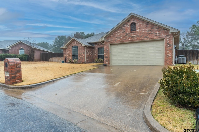 view of front facade with central AC and a garage