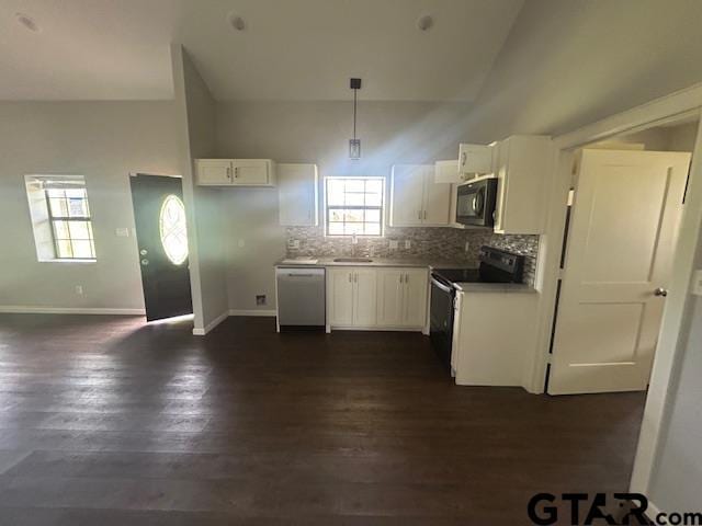 kitchen featuring black microwave, electric range oven, stainless steel dishwasher, a sink, and white cabinetry