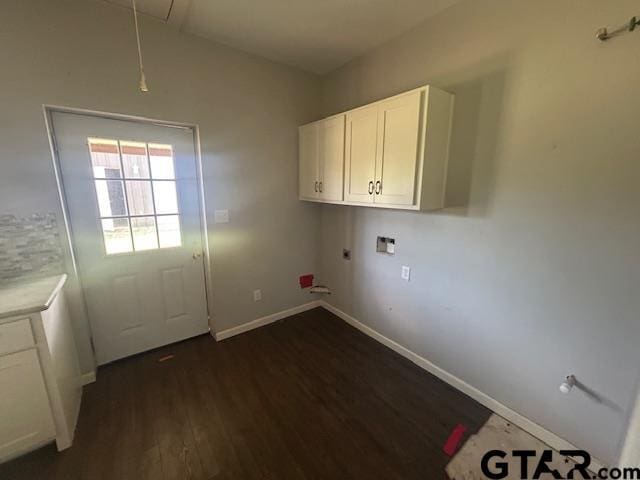 laundry room featuring washer hookup, attic access, dark wood finished floors, cabinet space, and baseboards