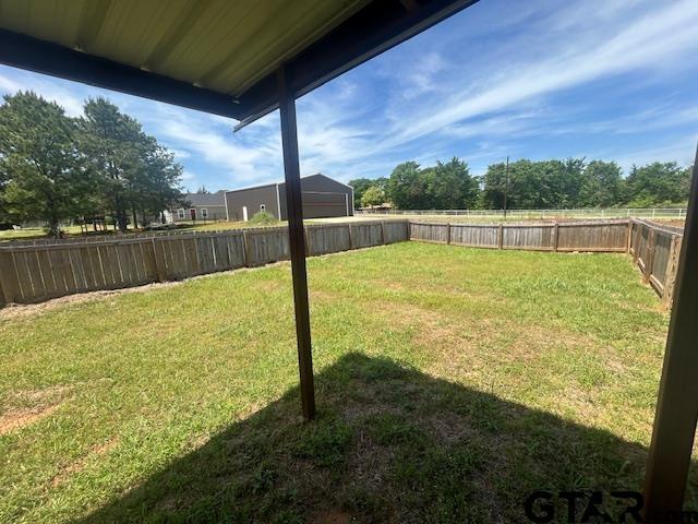 view of yard featuring a fenced backyard