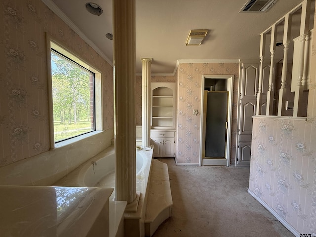 unfurnished bedroom with wallpapered walls, visible vents, ornamental molding, and light carpet