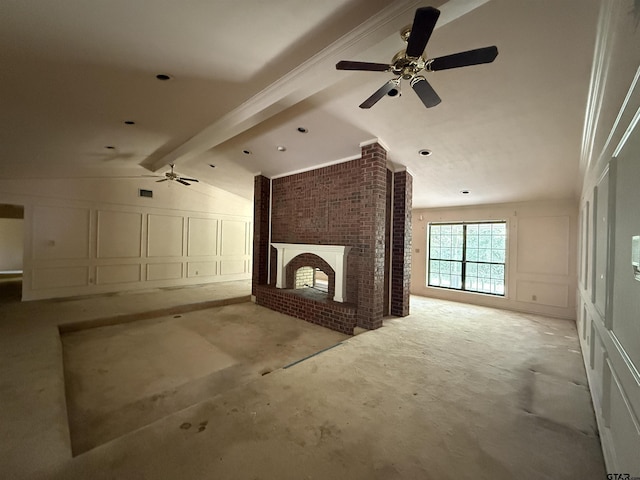 unfurnished living room with a brick fireplace, ceiling fan, and a decorative wall