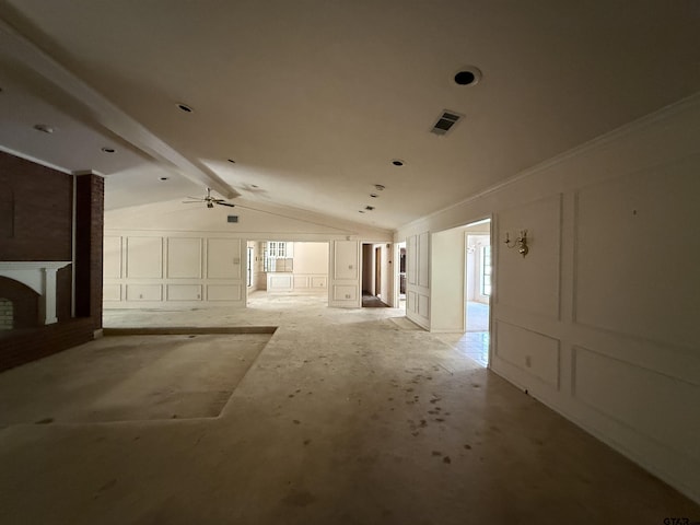 unfurnished living room with vaulted ceiling with beams, visible vents, ceiling fan, a decorative wall, and a fireplace
