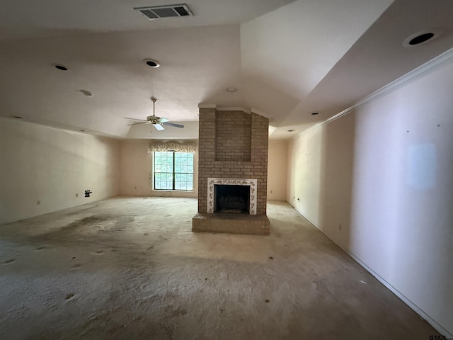unfurnished living room with vaulted ceiling, a ceiling fan, visible vents, and a fireplace