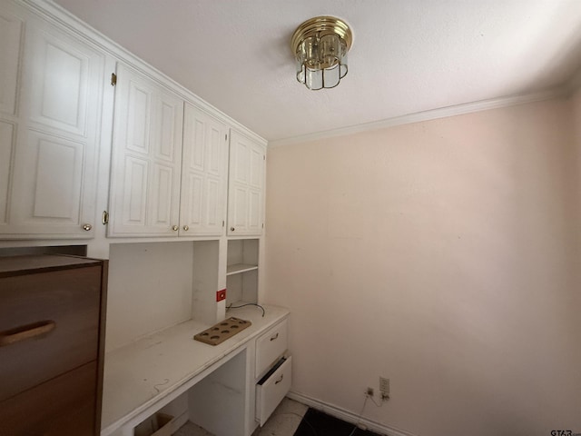 unfurnished office featuring crown molding