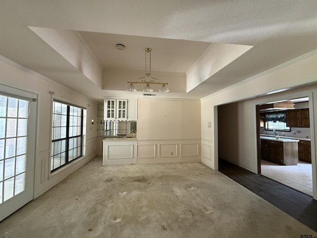 unfurnished dining area featuring crown molding and light colored carpet