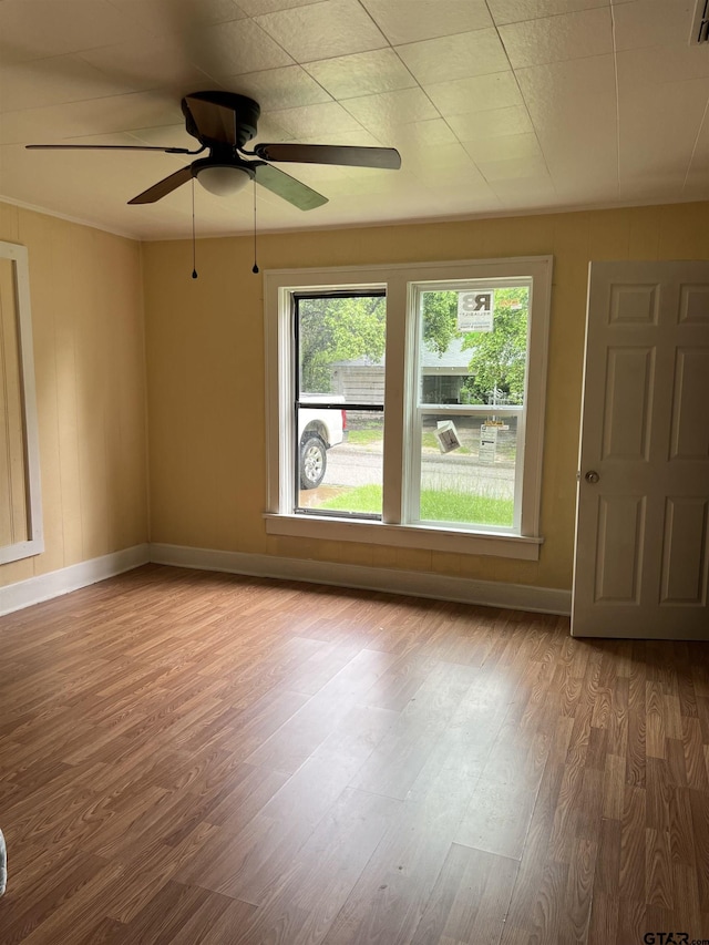 702 W Kilpatrick St, Mineola, TX 75773 - spare room with wood finished floors and ceiling fan