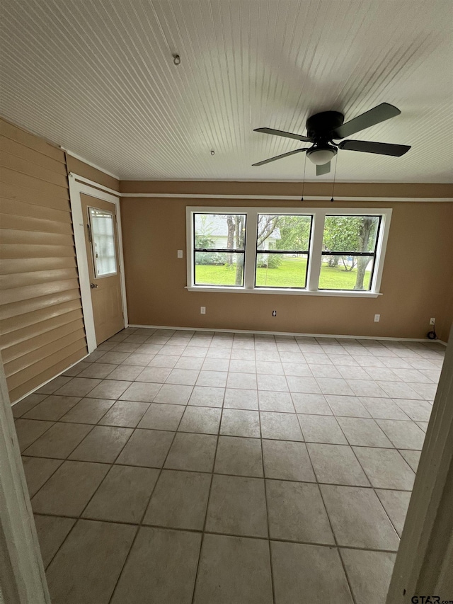 702 W Kilpatrick St, Mineola, TX 75773 - tiled empty room with ceiling fan