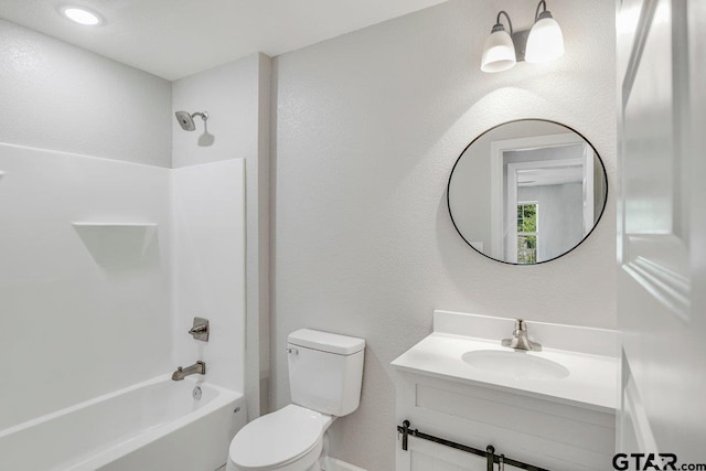bathroom with toilet, bathing tub / shower combination, and vanity