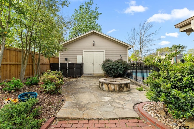 1122 S Chilton, Tyler, TX 75701 - fenced backyard with an outdoor fire pit and a patio area