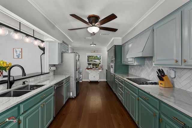 kitchen featuring sink, decorative backsplash, custom exhaust hood, stainless steel appliances, and crown molding