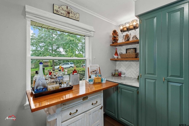 bar with crown molding, wood counters, green cabinetry, and backsplash