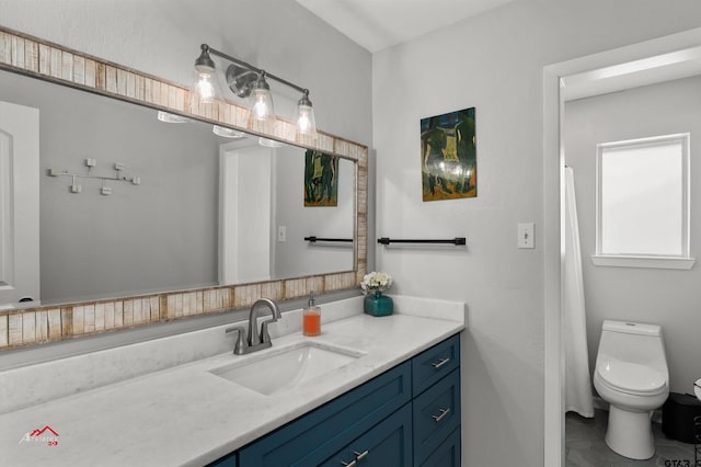 bathroom with vanity and toilet