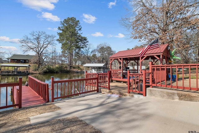 exterior space with a gazebo and a water view