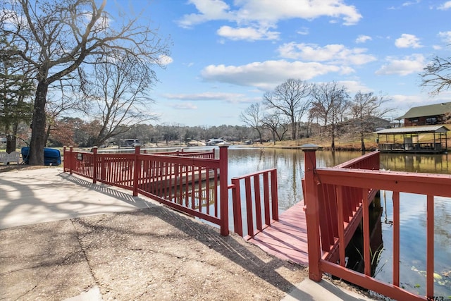 dock area with a water view