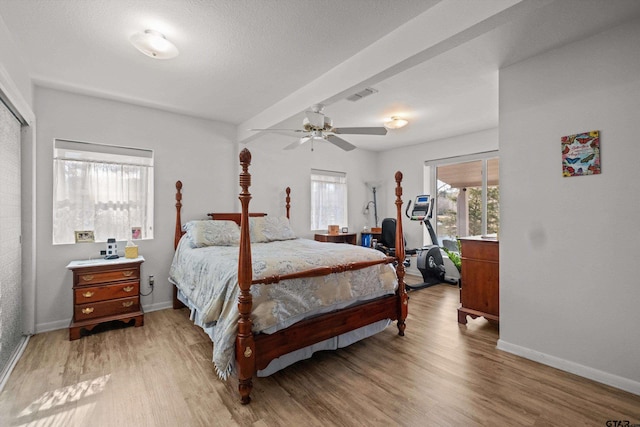 bedroom with ceiling fan and hardwood / wood-style flooring