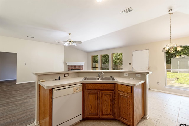 221 Maggie Cir, Flint, TX 75762 - kitchen with white dishwasher, a brick fireplace, ceiling fan, light countertops, and open floor plan