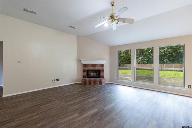 221 Maggie Cir, Flint, TX 75762 - unfurnished living room featuring lofted ceiling, dark wood finished floors, a fireplace, and a ceiling fan