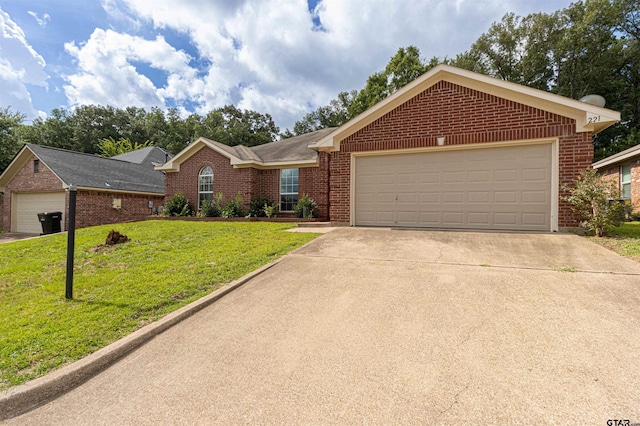 221 Maggie Cir, Flint, TX 75762 - ranch-style house with brick siding, a front lawn, concrete driveway, and an attached garage
