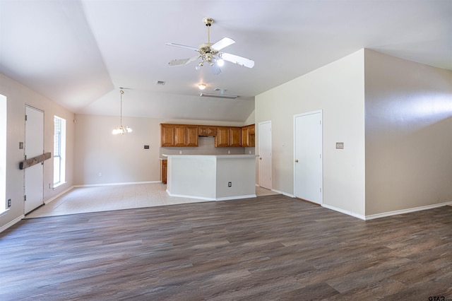 221 Maggie Cir, Flint, TX 75762 - unfurnished living room with vaulted ceiling, light wood finished floors, and a ceiling fan