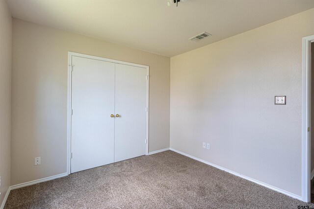 221 Maggie Cir, Flint, TX 75762 - unfurnished bedroom with carpet floors and a closet