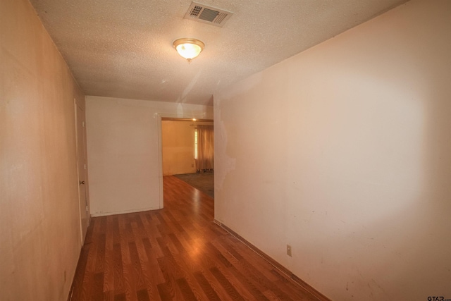 14832 Fm 2661, Flint, TX 75762 - corridor with wood finished floors and a textured ceiling