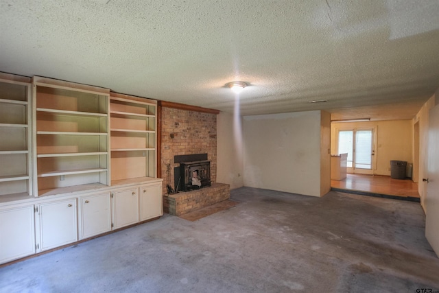14832 Fm 2661, Flint, TX 75762 - unfurnished living room featuring a textured ceiling