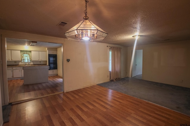 14832 Fm 2661, Flint, TX 75762 - spare room featuring dark wood-style floors, a sink, a textured ceiling, and baseboards