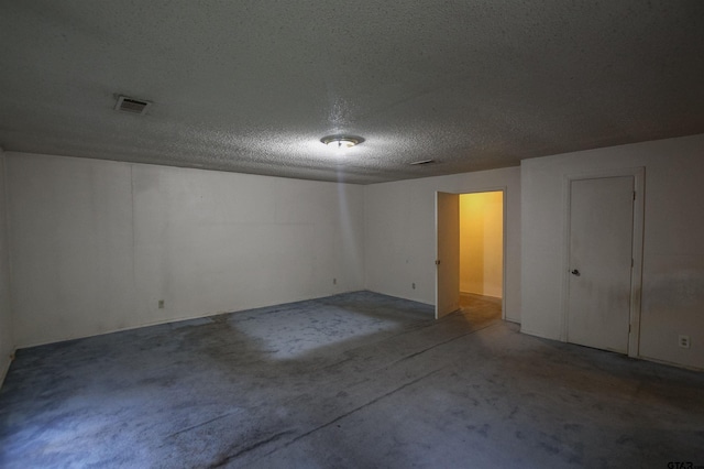14832 Fm 2661, Flint, TX 75762 - unfurnished bedroom featuring unfinished concrete flooring and a textured ceiling