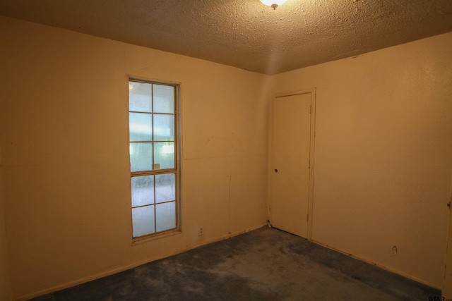 14832 Fm 2661, Flint, TX 75762 - unfurnished room with dark colored carpet and a textured ceiling