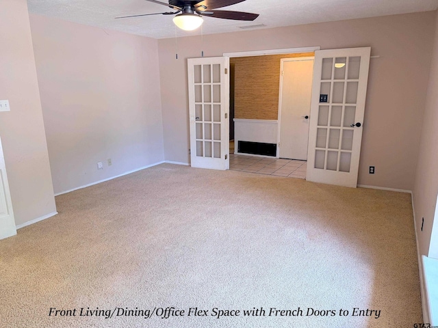 3900 S Donnybrook Ave, Tyler, TX 75703 - carpeted spare room featuring french doors, a ceiling fan, and baseboards