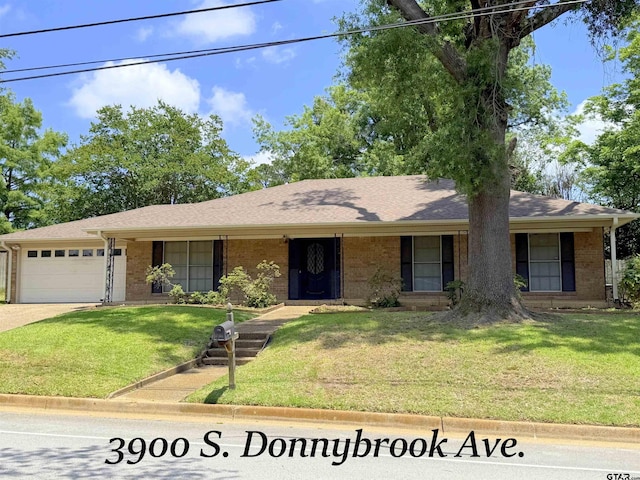3900 S Donnybrook Ave, Tyler, TX 75703 - ranch-style house with brick siding, an attached garage, a front yard, and concrete driveway