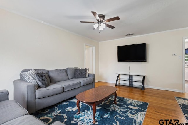 1135 E Sixth St, Tyler, TX 75701 - living room featuring ceiling fan, wood finished floors, and crown molding