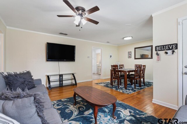 1135 E Sixth St, Tyler, TX 75701 - living area with ornamental molding, wood finished floors, and a ceiling fan