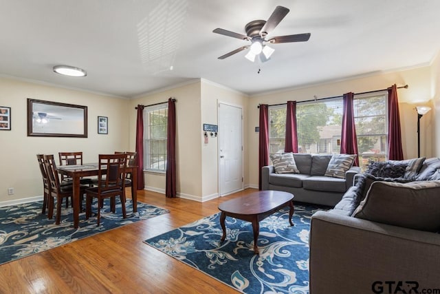 1135 E Sixth St, Tyler, TX 75701 - living area featuring wood finished floors, ornamental molding, ceiling fan, and plenty of natural light