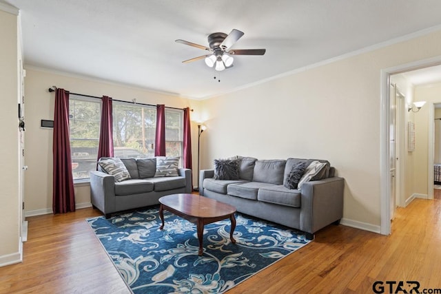 1135 E Sixth St, Tyler, TX 75701 - living room featuring a ceiling fan, light wood-style floors, and crown molding