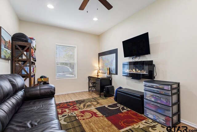 1135 E Sixth St, Tyler, TX 75701 - living room featuring ceiling fan, wood finished floors, recessed lighting, and a glass covered fireplace