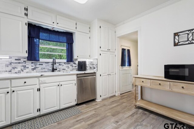 1135 E Sixth St, Tyler, TX 75701 - kitchen with dishwasher, decorative backsplash, light wood-style floors, light countertops, and ornamental molding