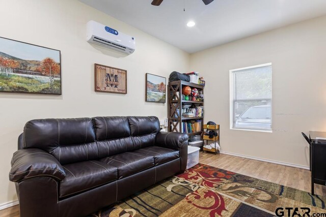 1135 E Sixth St, Tyler, TX 75701 - living room with a wall mounted air conditioner, wood finished floors, ceiling fan, and recessed lighting