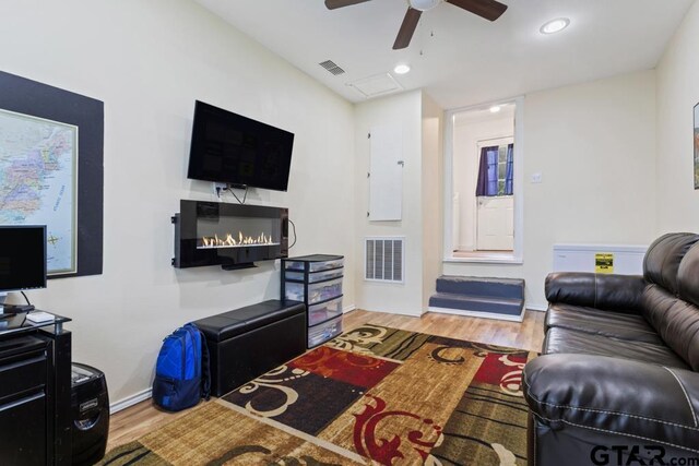 1135 E Sixth St, Tyler, TX 75701 - living area with a ceiling fan, wood finished floors, and recessed lighting