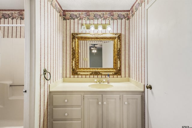 bathroom with vanity and a textured ceiling