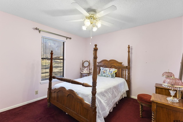 carpeted bedroom featuring ceiling fan and a textured ceiling