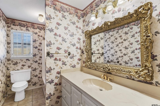 bathroom featuring vanity, tile patterned floors, and toilet