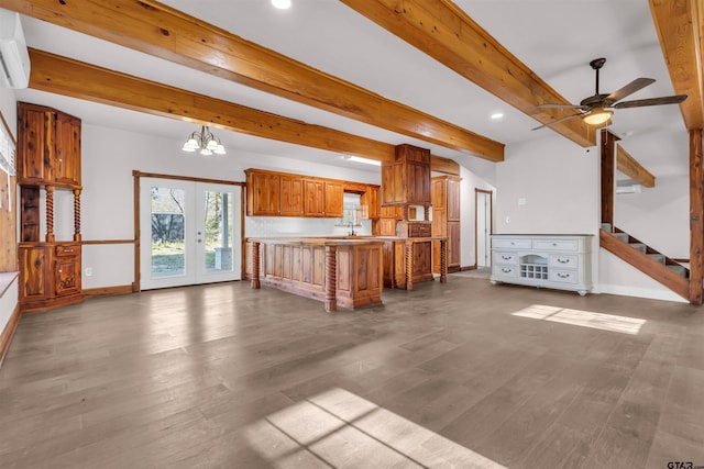kitchen featuring open floor plan, light countertops, baseboards, beamed ceiling, and brown cabinetry