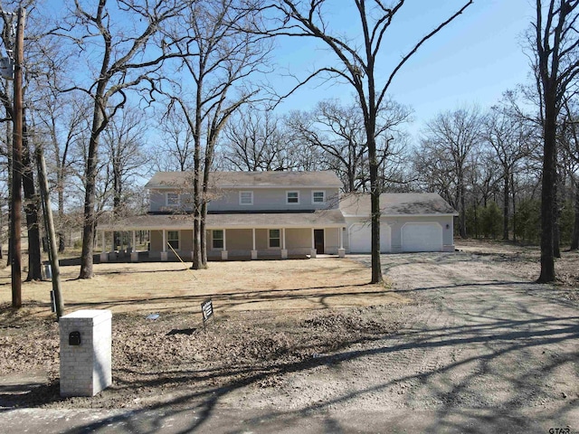 view of front of property with a garage and covered porch