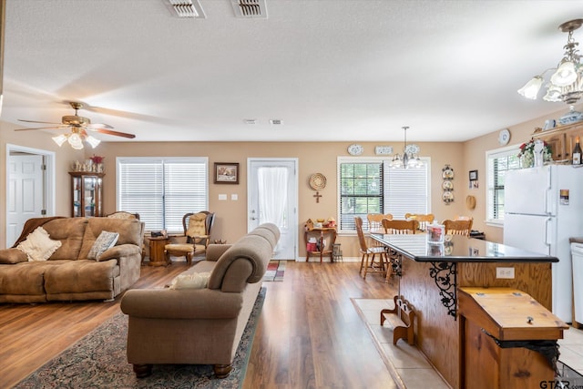 2983 Fm 17, Grand Saline, TX 75140 - living area with a chandelier, light wood-style floors, and ceiling fan